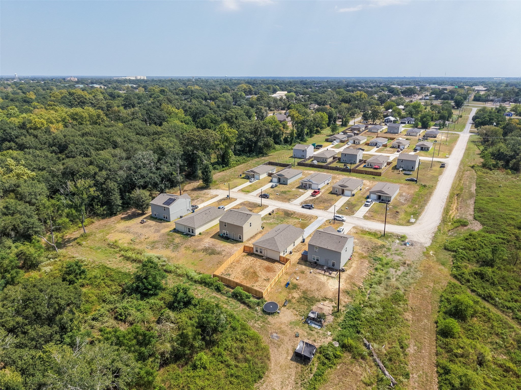 2537 18th Street Hempstead, TX 77445 - Photo 25 of 28 Aerial view showcasing the neighborhood, surrounding open space, and residential growth in the Hempstead area.