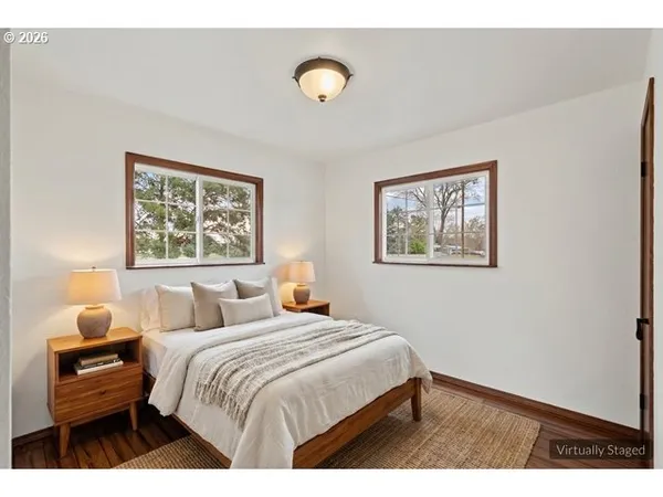 a bedroom with a bed and a lamp