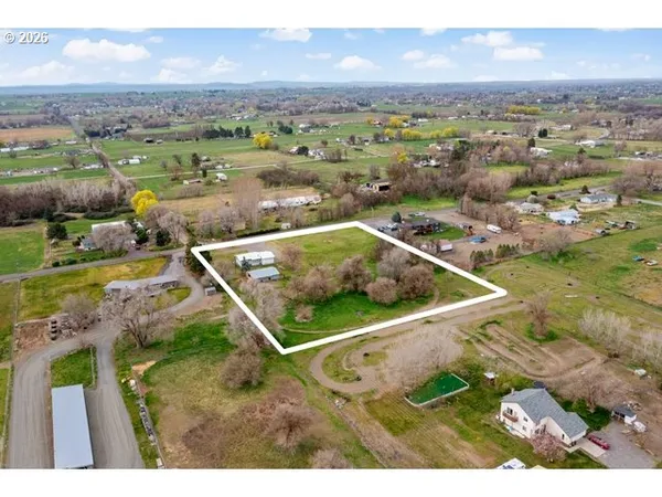 a open kitchen with stainless steel appliances kitchen island a refrigerator and a stove