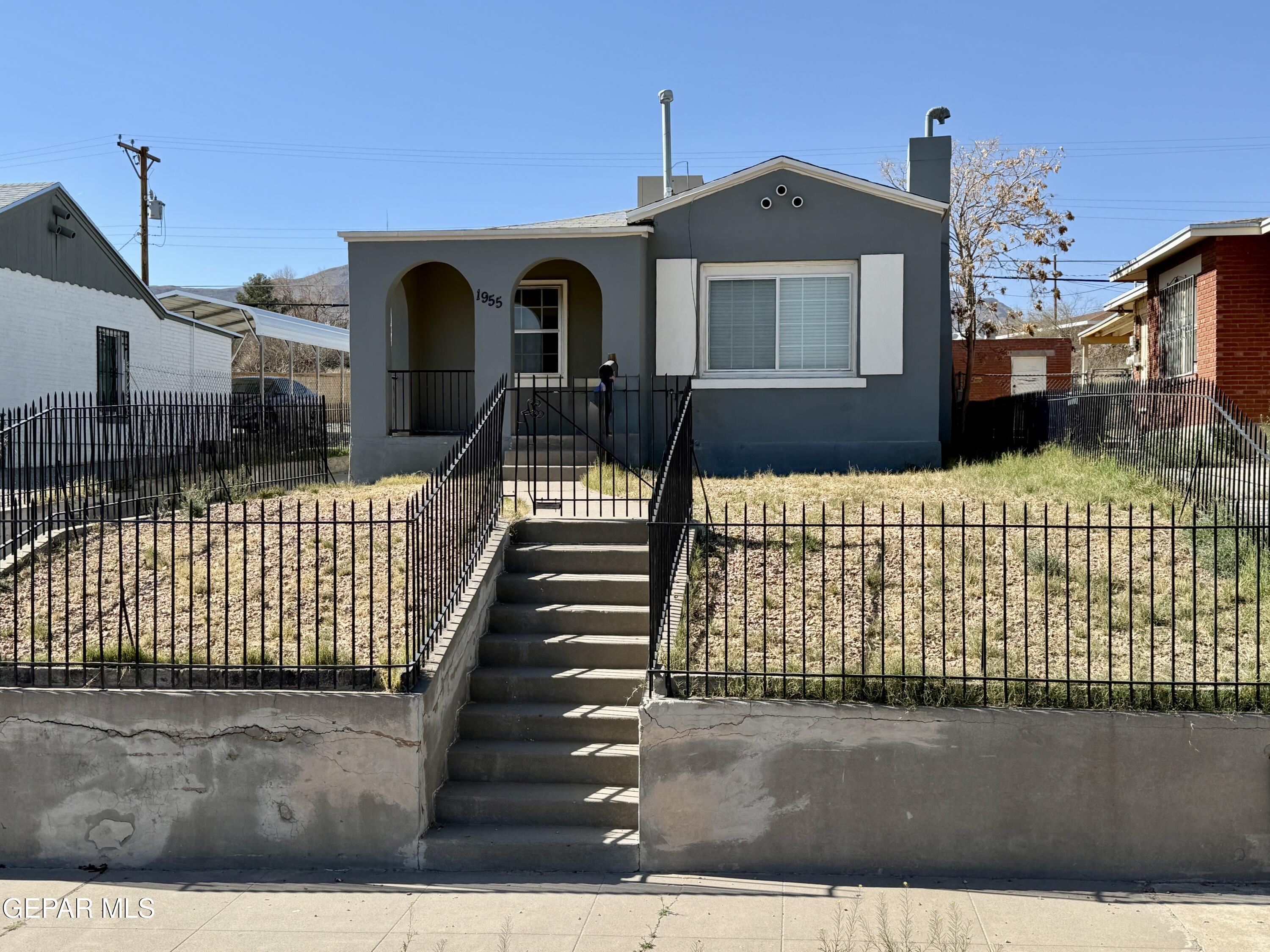 1955 Happer Street El Paso, TX 79903 - Photo 1 of 1 a front view of a house with large windows