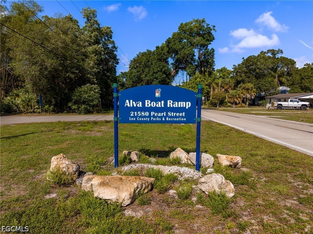17290 Rewis Road Alva, FL 33920 - Photo 42 of 50 a sign that is on the side of the road