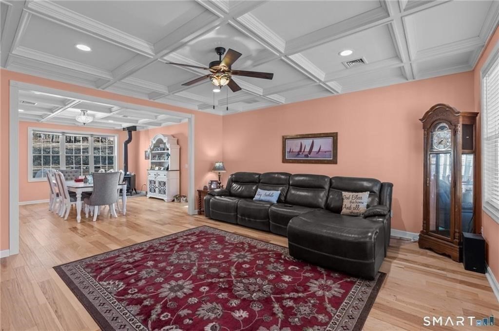 117 New Road Thompson, CT 06277 - Photo 11 of 29 a living room with furniture and a rug