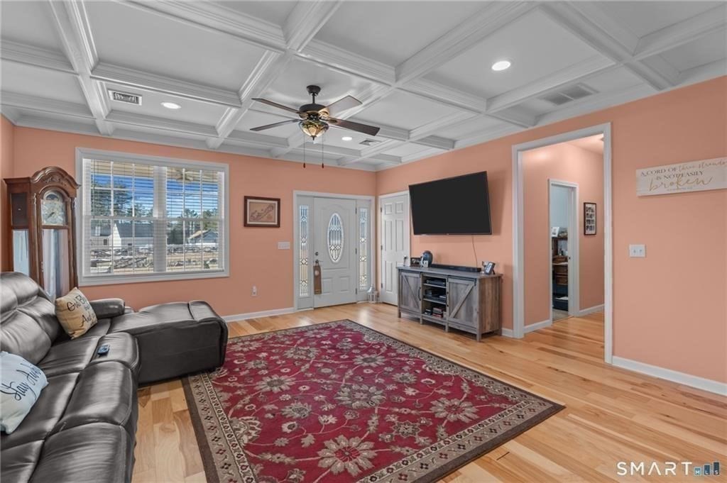 117 New Road Thompson, CT 06277 - Photo 12 of 29 a living room with furniture and a flat screen tv