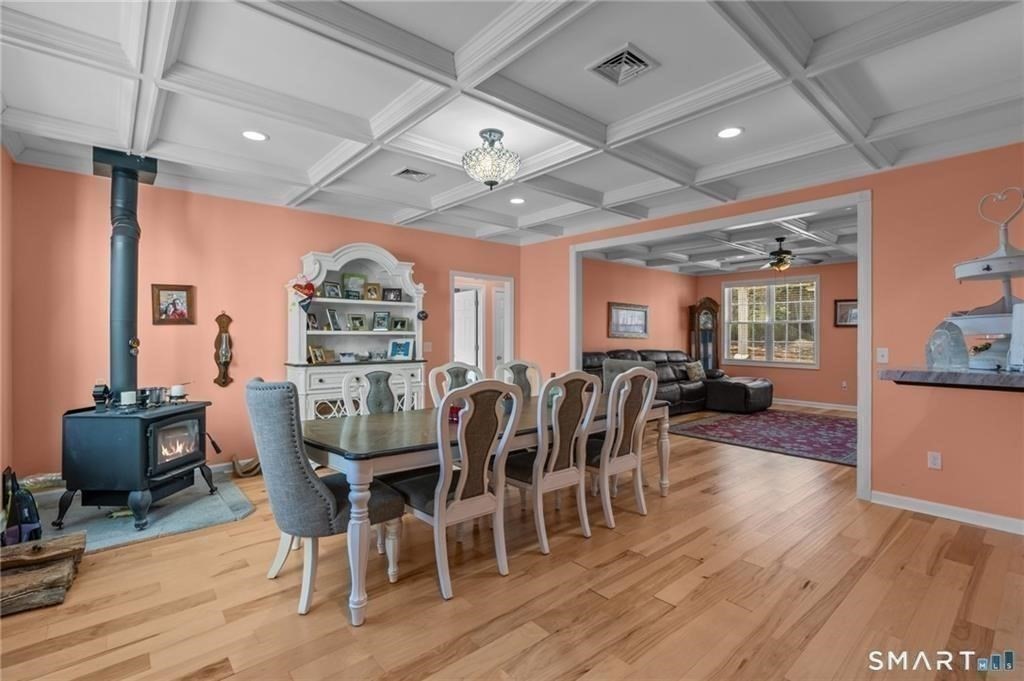 117 New Road Thompson, CT 06277 - Photo 13 of 29 a view of a dining room with furniture window and wooden floor