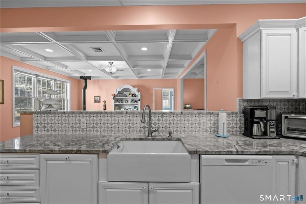 117 New Road Thompson, CT 06277 - Photo 16 of 29 a bathroom with a sink and a mirror