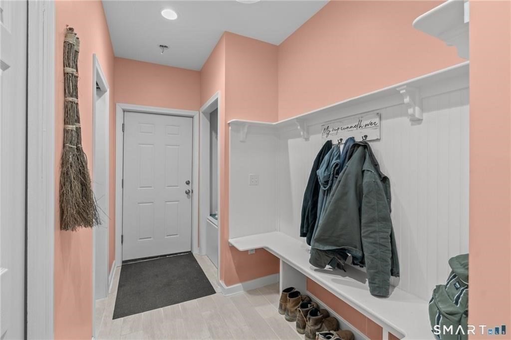117 New Road Thompson, CT 06277 - Photo 17 of 29 a view of walk in closet with clothes and shoes