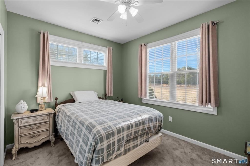 117 New Road Thompson, CT 06277 - Photo 20 of 29 a bedroom with a bed and window