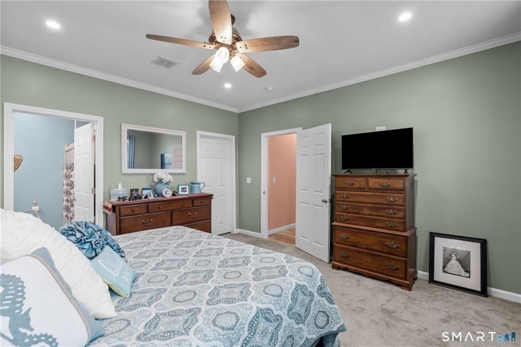 117 New Road Thompson, CT 06277 - Photo 24 of 29 a bedroom with a bed and a television
