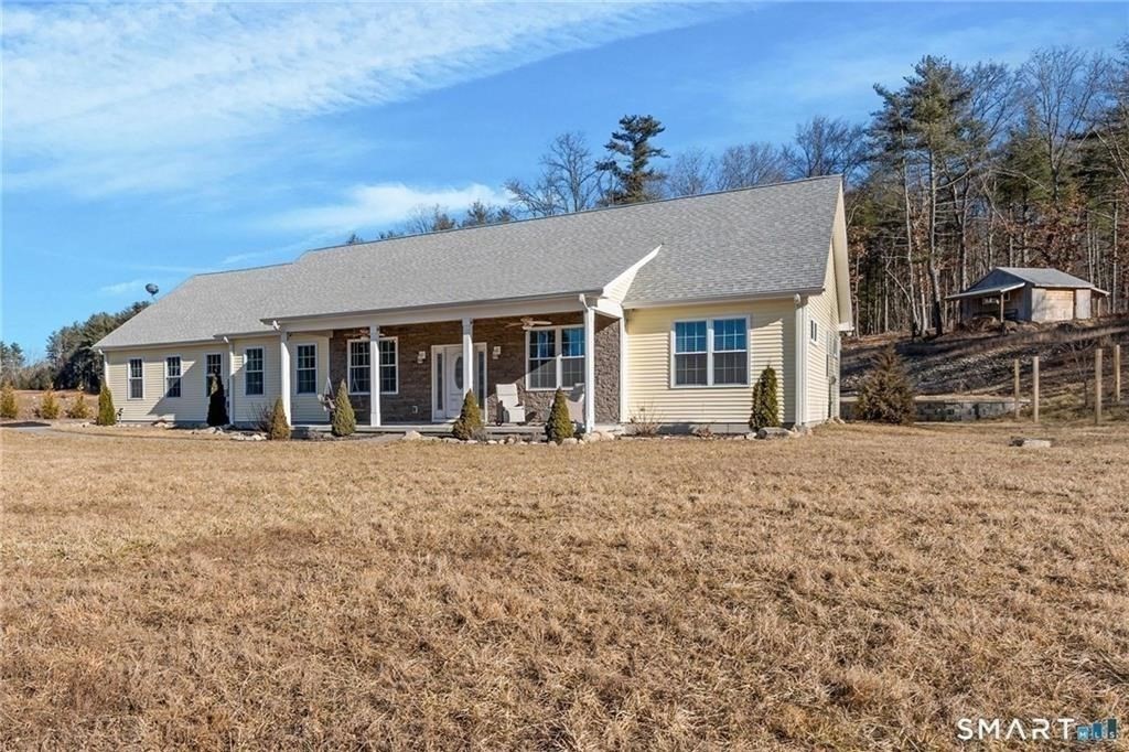 117 New Road Thompson, CT 06277 - Photo 4 of 29 front view of a house with a big yard