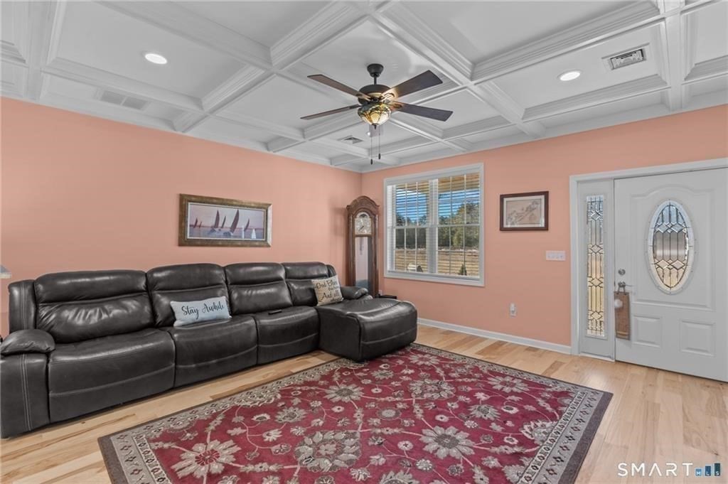 117 New Road Thompson, CT 06277 - Photo 10 of 29 a living room with a couch and a rug