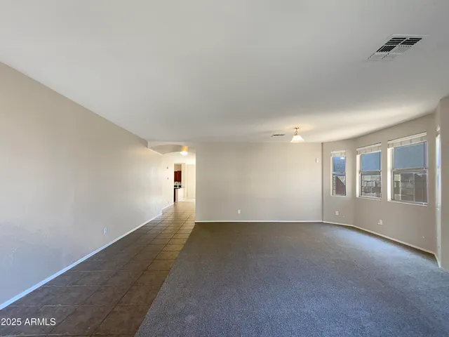 a view of empty room with windows