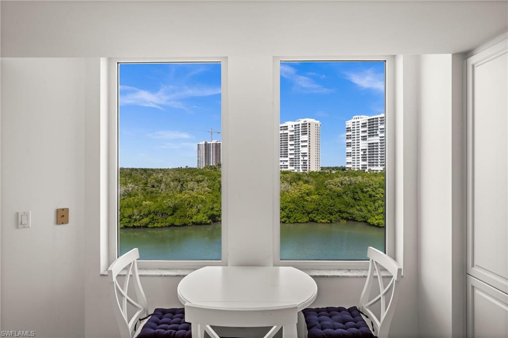 445 Dockside Drive, Unit A504 Naples, FL 34110 - Photo 15 of 50 a bathroom with a toilet a sink and a mirror