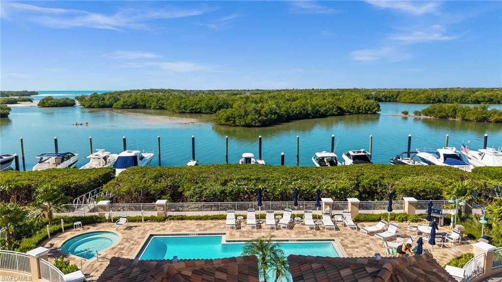 445 Dockside Drive, Unit A504 Naples, FL 34110 - Photo 31 of 50 a view of a lake with houses
