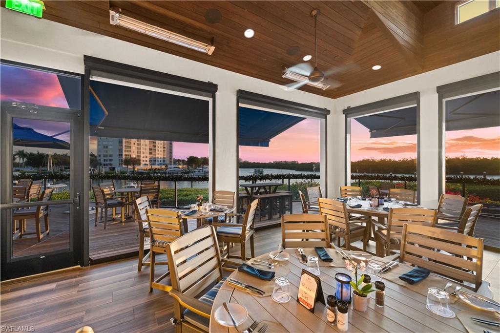 445 Dockside Drive, Unit A504 Naples, FL 34110 - Photo 40 of 50 a very nice looking living room with furniture and floor to ceiling windows