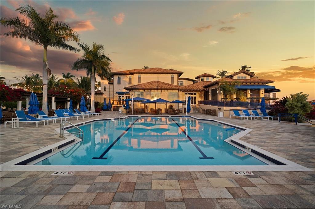 445 Dockside Drive, Unit A504 Naples, FL 34110 - Photo 46 of 50 a view of a swimming pool with outdoor seating