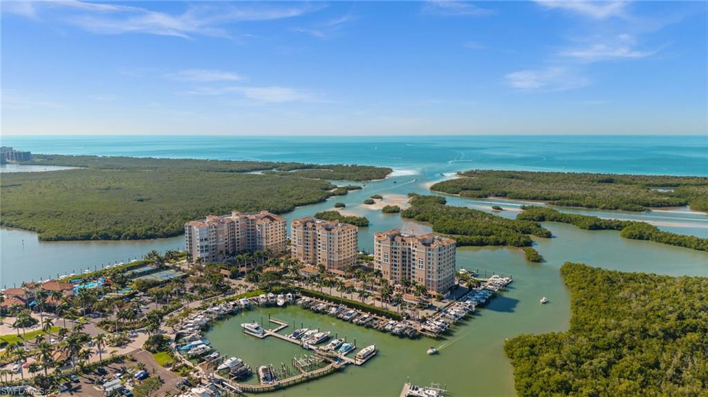 445 Dockside Drive, Unit A504 Naples, FL 34110 - Photo 48 of 50 an aerial view of a house with a lake view