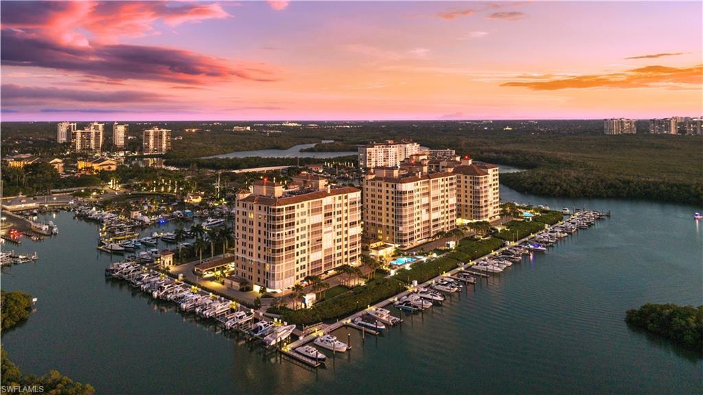 445 Dockside Drive, Unit A504 Naples, FL 34110 - Photo 7 of 50 a view of a lake with sitting space