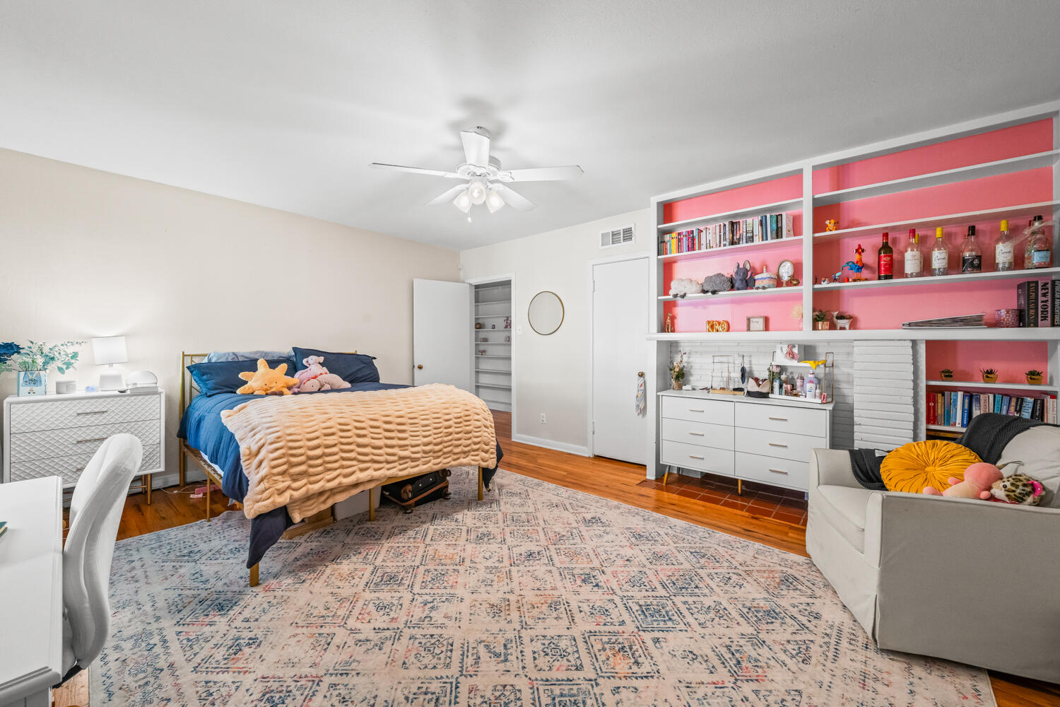 3310 24th Street Lubbock, TX 79410 - Photo 28 of 65 a bedroom with a bed and a chandelier