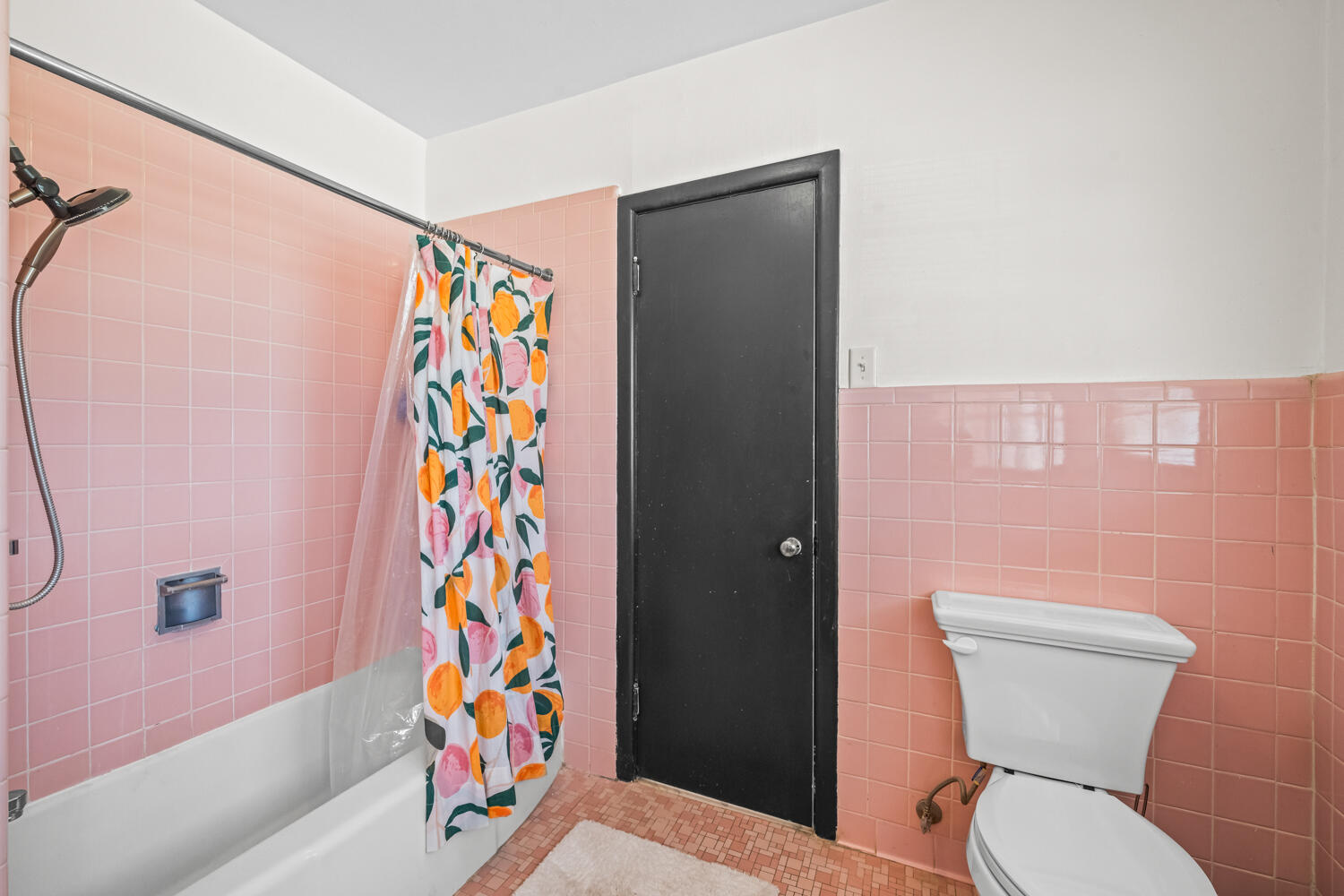 3310 24th Street Lubbock, TX 79410 - Photo 37 of 65 a bathroom with a toilet and a shower curtain