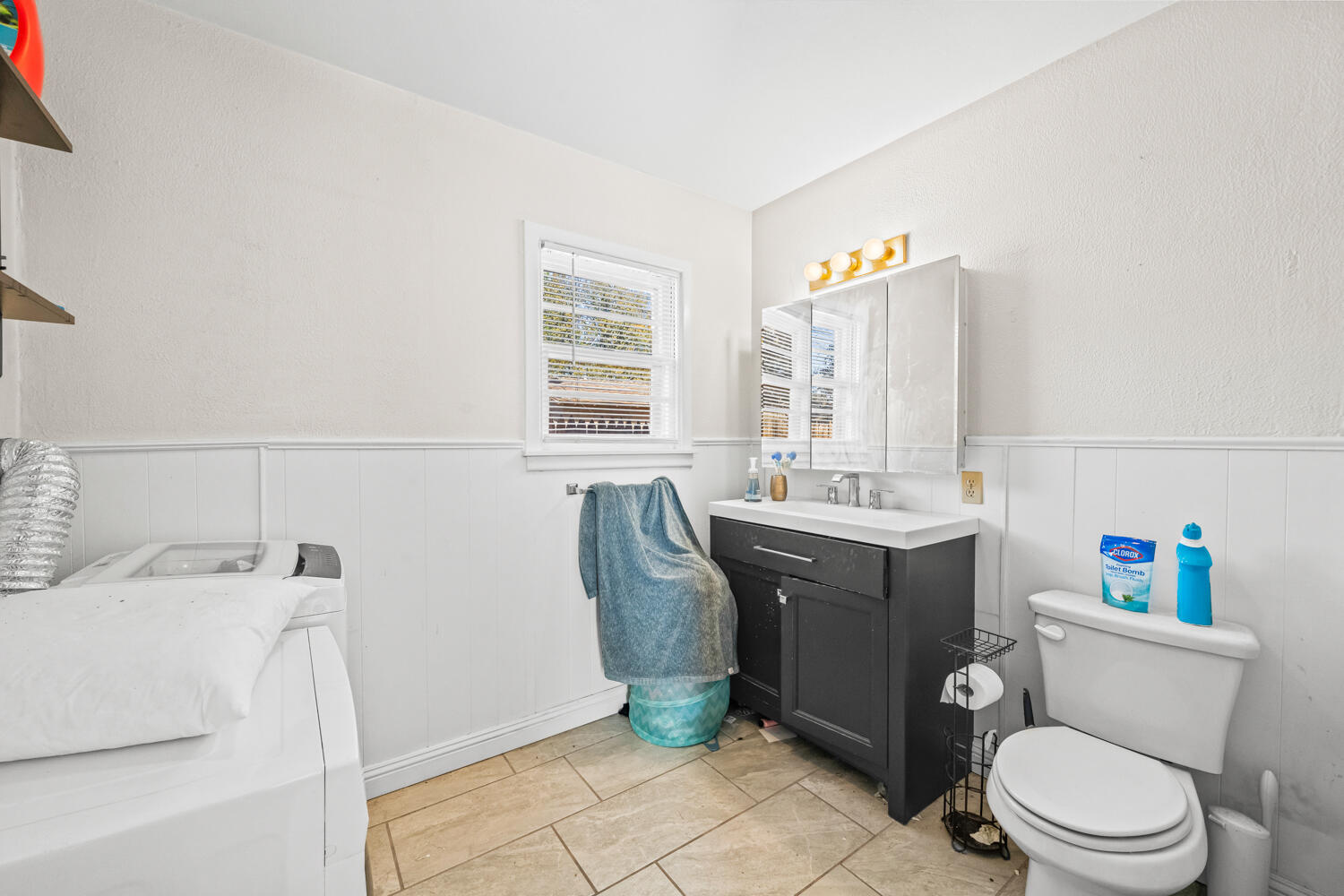 3310 24th Street Lubbock, TX 79410 - Photo 46 of 65 a bathroom with a sink vanity mirror and toilet