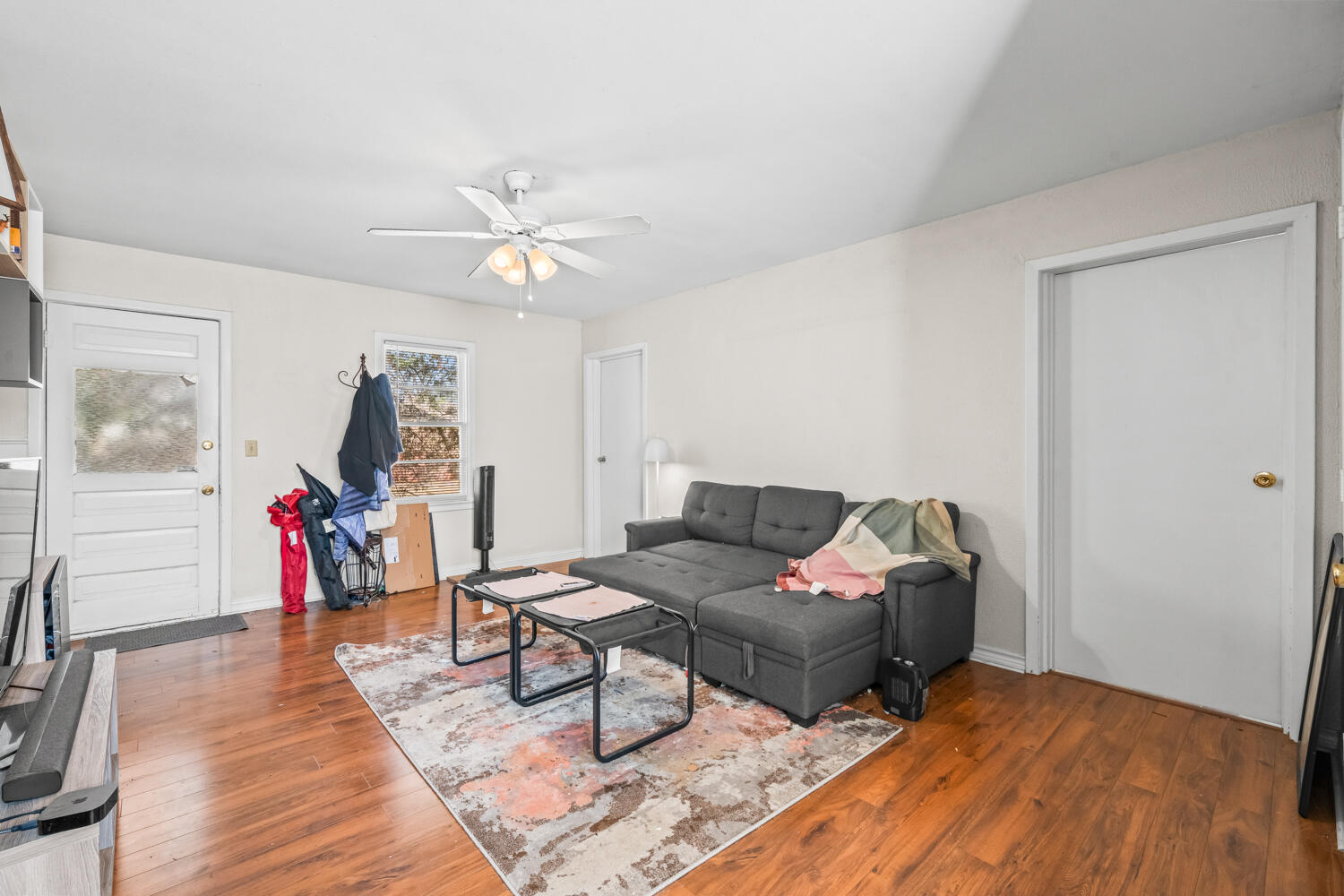 3310 24th Street Lubbock, TX 79410 - Photo 49 of 65 a living room with furniture and a wooden floor
