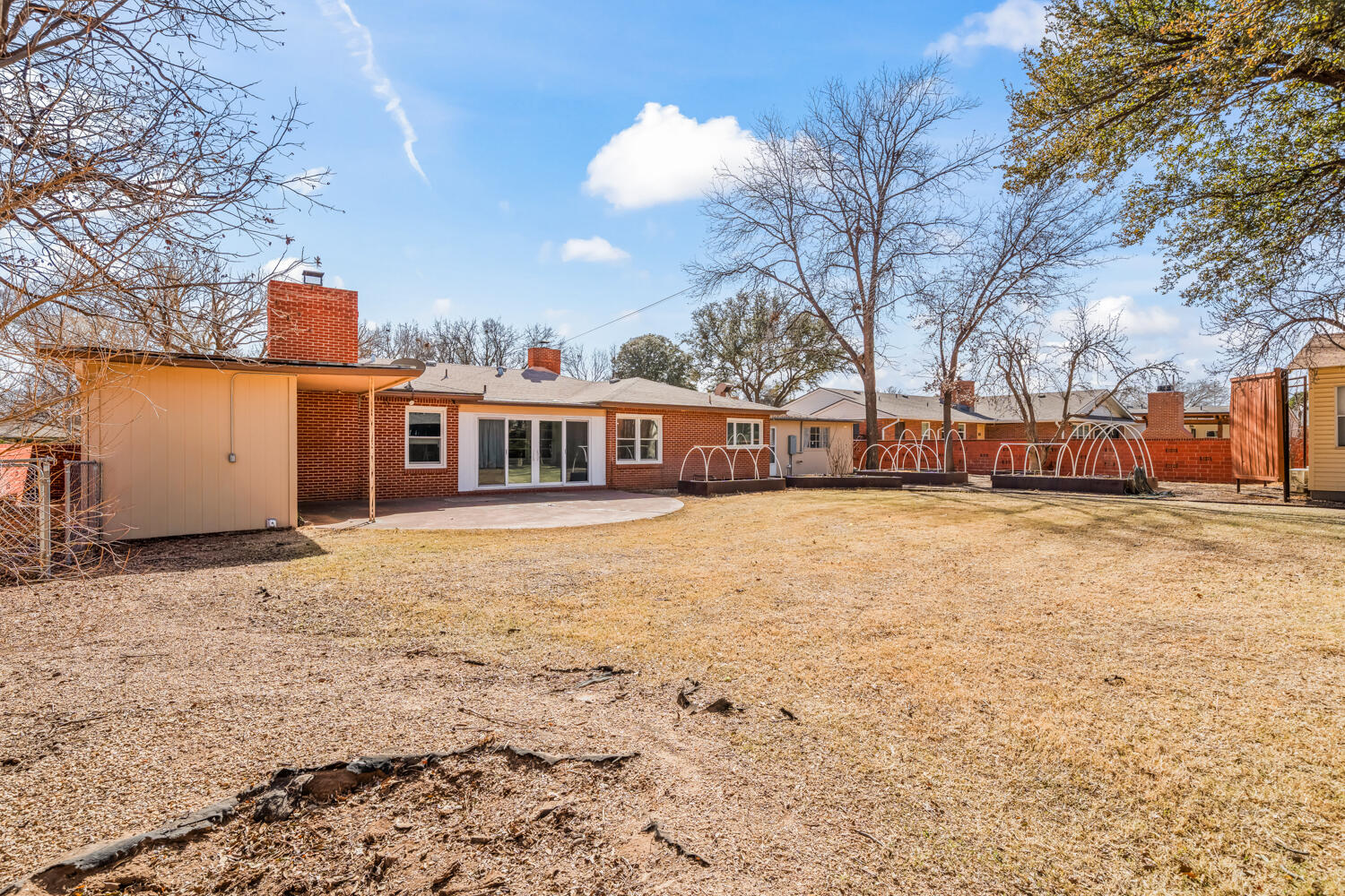 3310 24th Street Lubbock, TX 79410 - Photo 56 of 65 a front view of a house with a yard