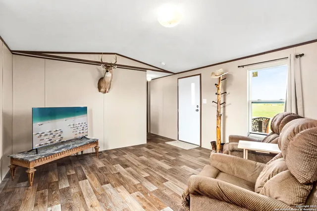 a bedroom with a bed couch and a window