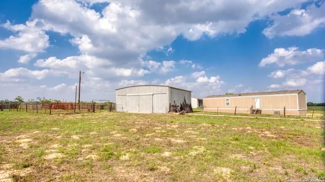 a view of a large building with a yard