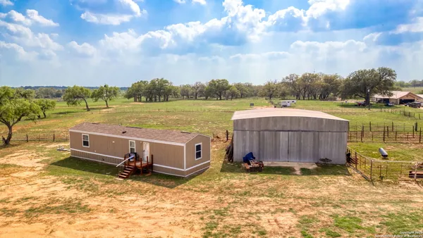 a view of a lake with a house in the background