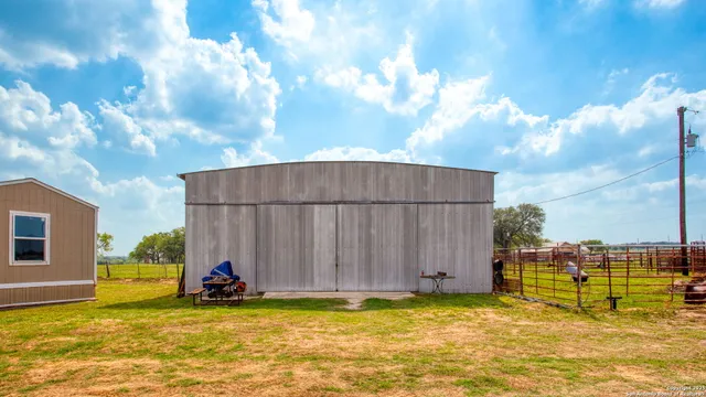 a view of a backyard with sitting area
