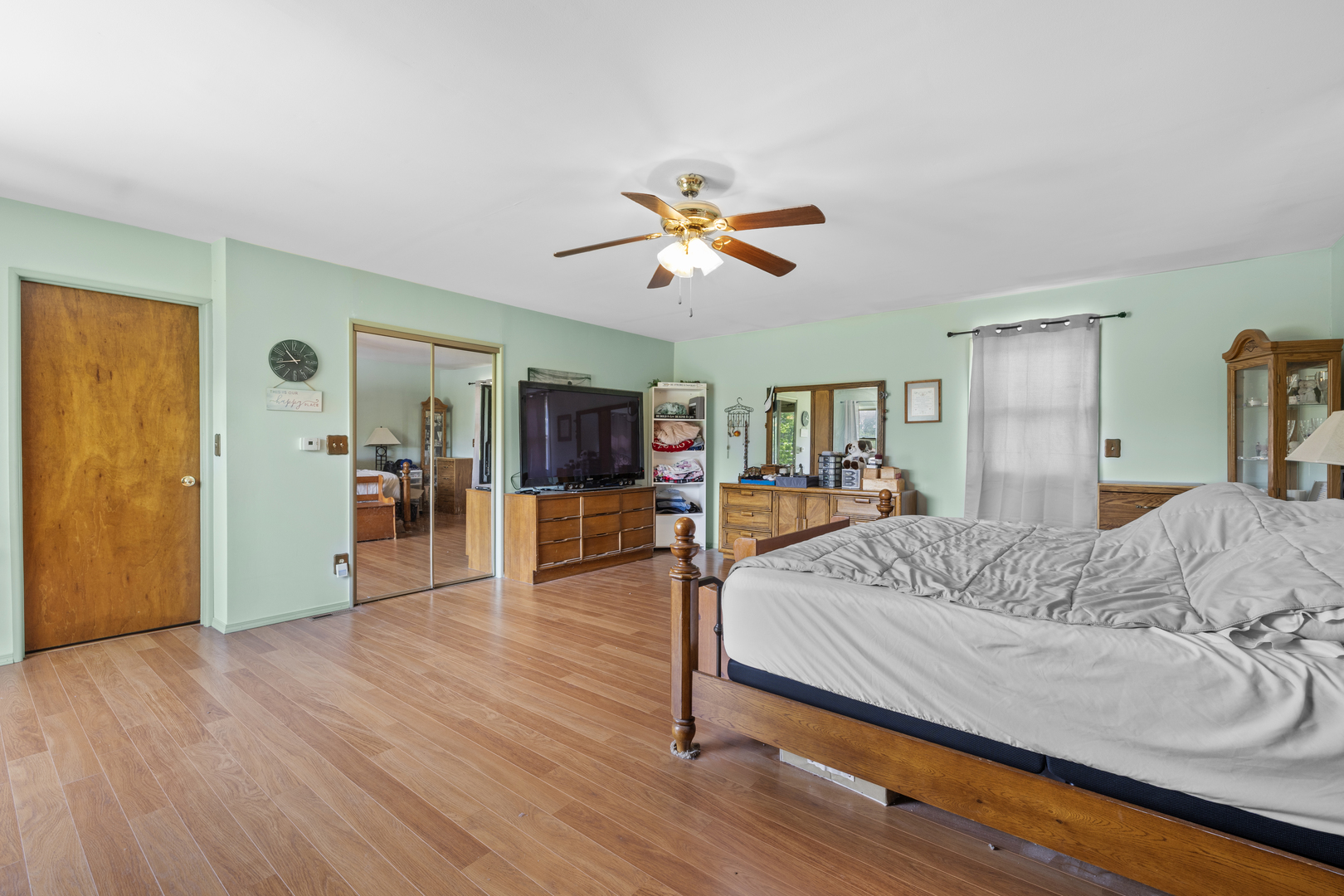 4 Saugatuck Road Montgomery, IL 60538 - Photo 18 of 24 a spacious bedroom with a bed and a chandelier