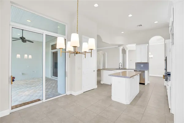 a large bathroom with a glass shower door