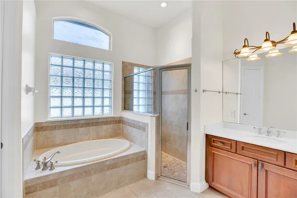 a bathroom with a bathtub and a sink