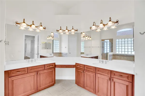 a bathroom with a double vanity sink and a mirror