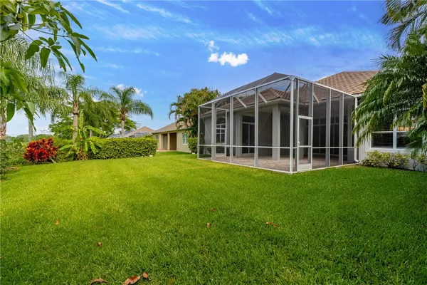 a view of an house with backyard space and garden