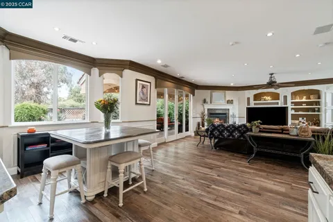 a view of a livingroom with furniture and a flat screen tv