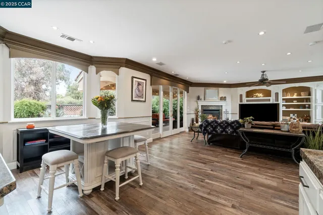 a view of a livingroom with furniture and a flat screen tv
