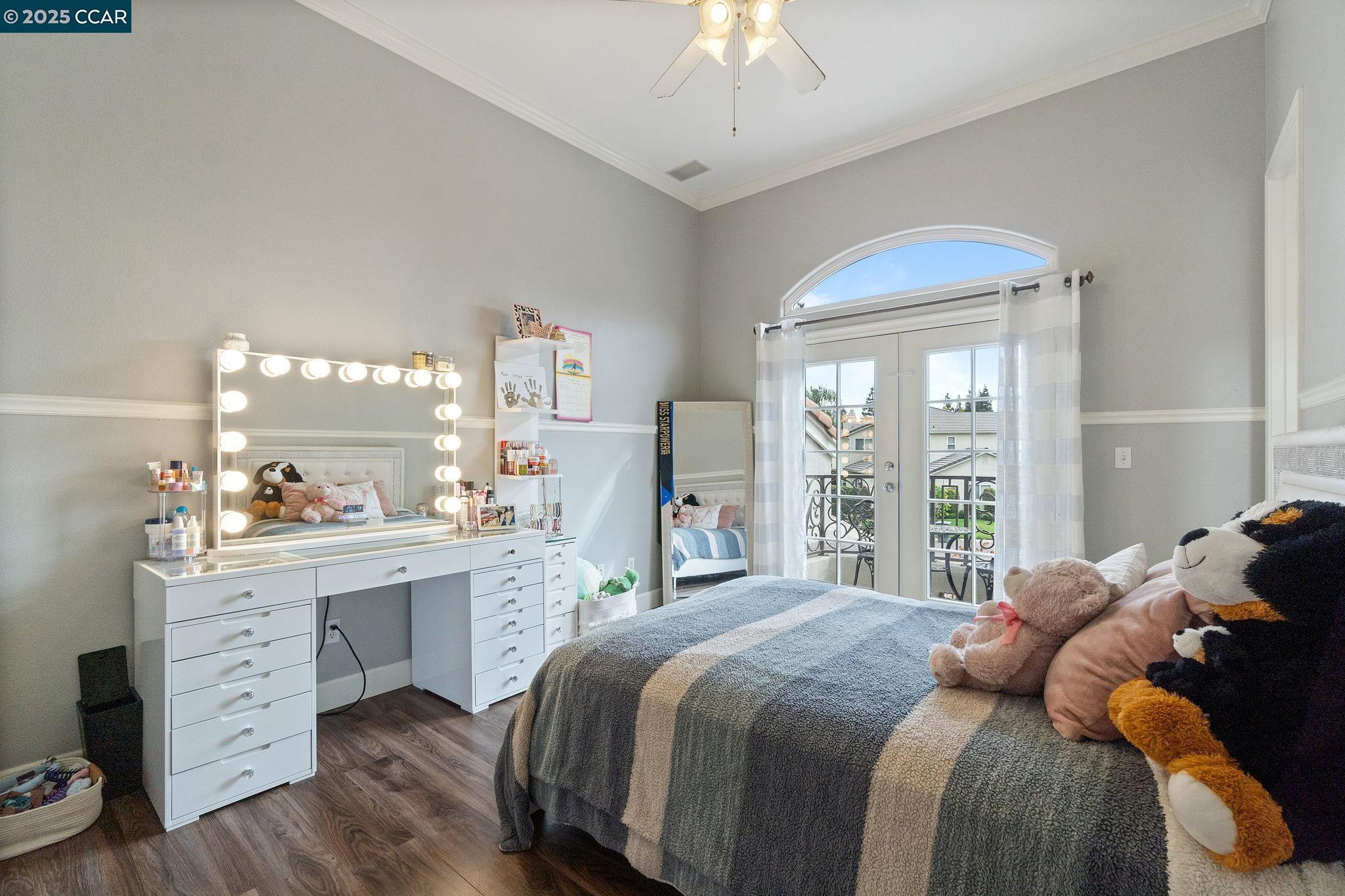 2550 East Jenny Avenue Fresno, CA 93720 - Photo 28 of 49 a bedroom with a bed and a large window