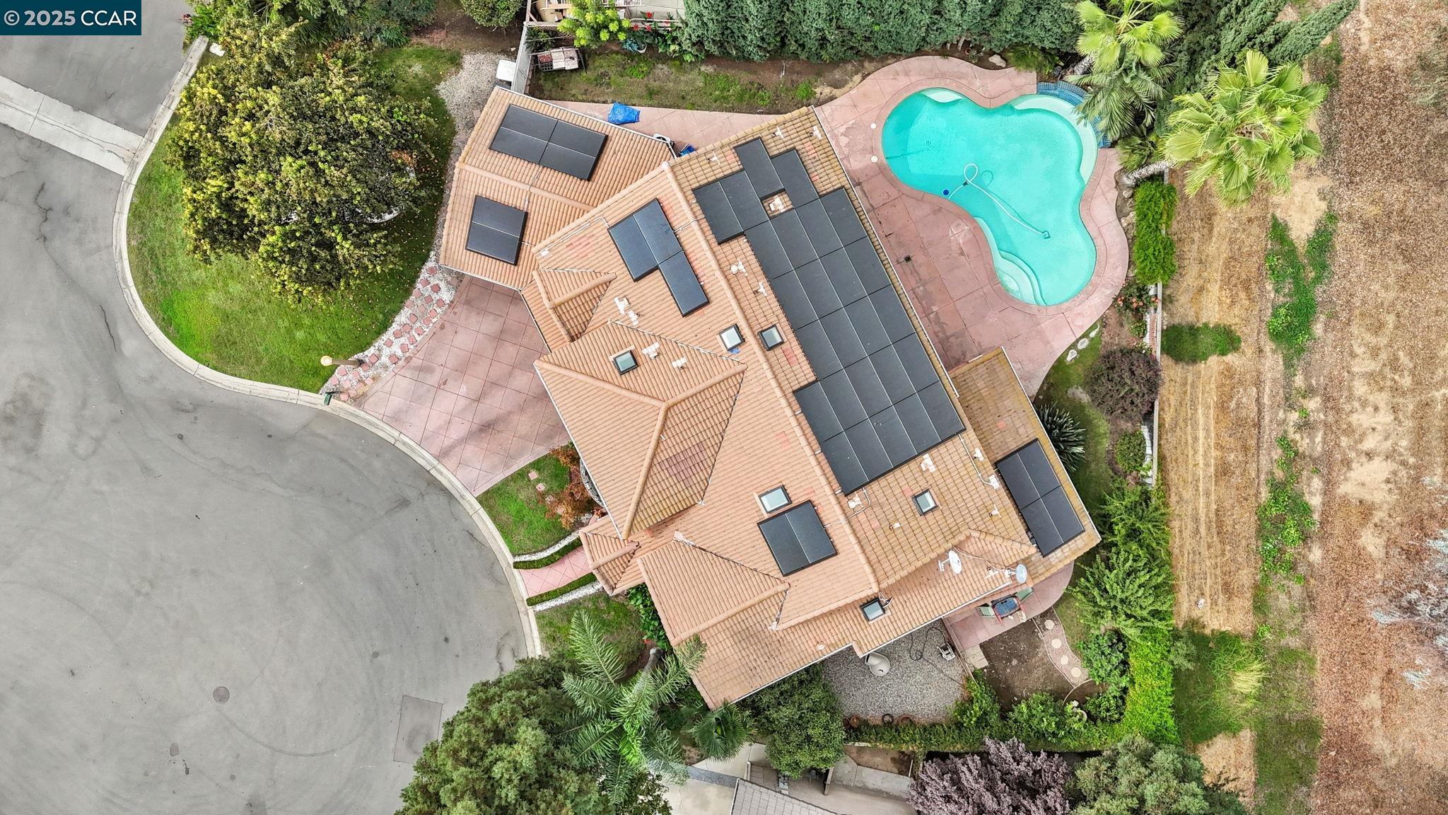 2550 East Jenny Avenue Fresno, CA 93720 - Photo 4 of 49 an aerial view of a house with a swimming pool