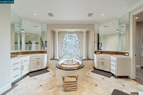 a large spacious bathroom with a double vanity sink and a mirror