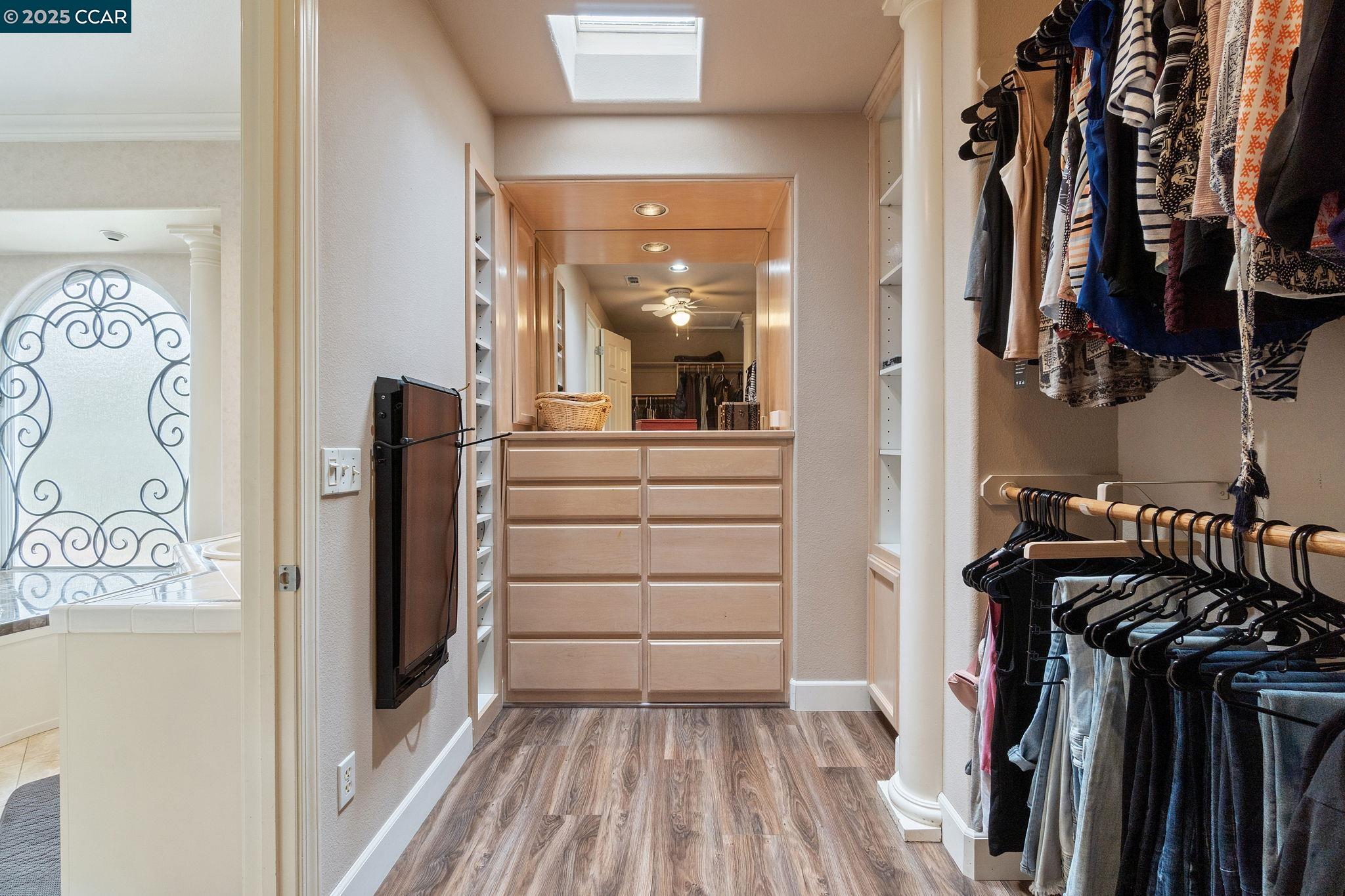 2550 East Jenny Avenue Fresno, CA 93720 - Photo 45 of 49 a view of walk in closet with clothes and shoes
