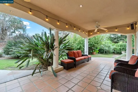a outdoor living space with furniture and garden view