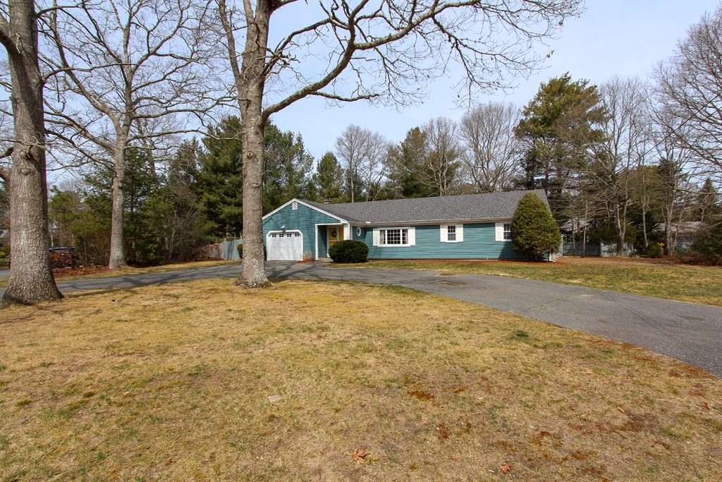47 Foxglove Road Barnstable, MA 02632 - Photo 1 of 33 a front view of a house with large trees