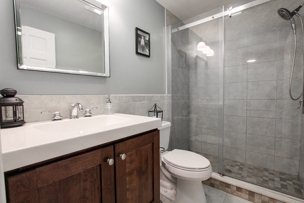 47 Foxglove Road Barnstable, MA 02632 - Photo 19 of 33 a bathroom with a sink a toilet and shower