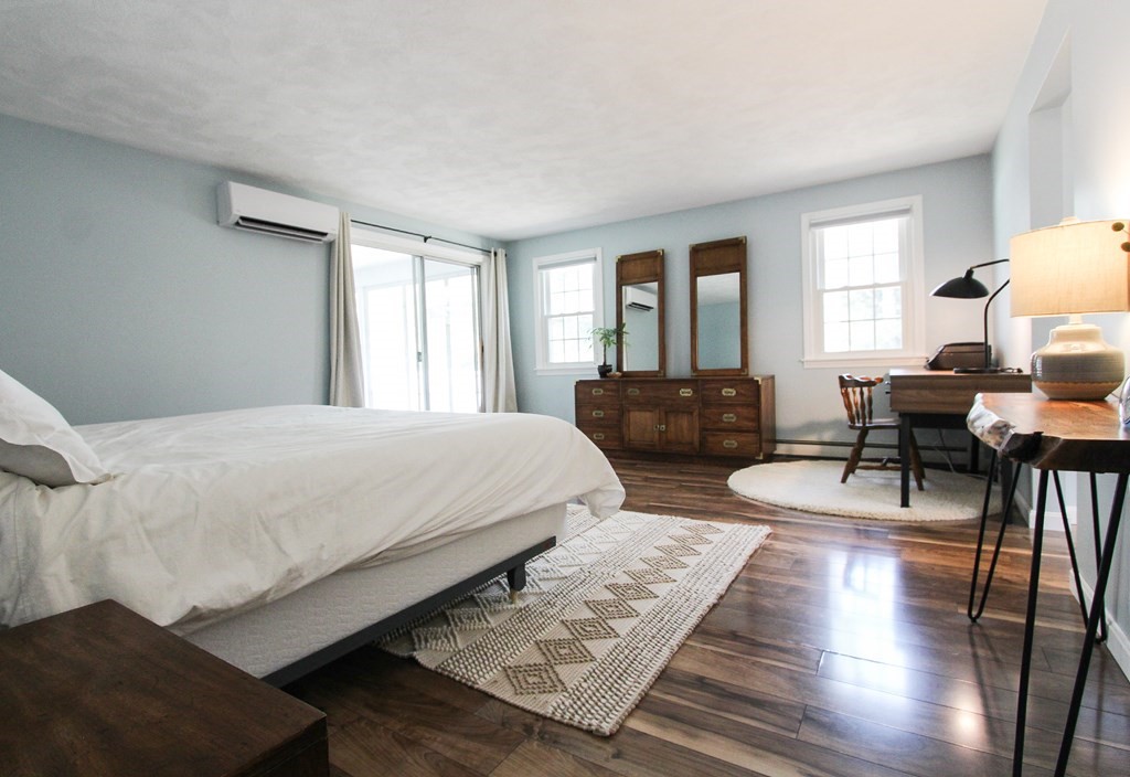 47 Foxglove Road Barnstable, MA 02632 - Photo 20 of 33 a spacious bedroom with two beds and wooden floor