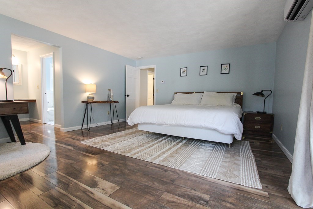 47 Foxglove Road Barnstable, MA 02632 - Photo 21 of 33 a bedroom with a bed and a couch