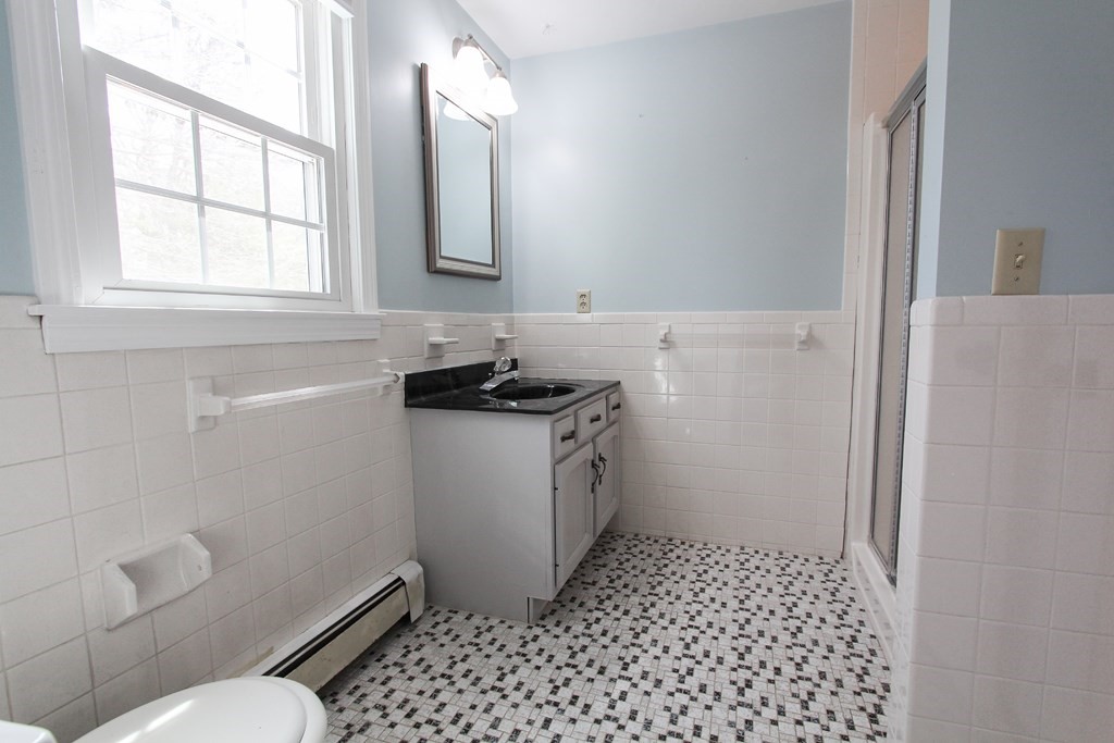 47 Foxglove Road Barnstable, MA 02632 - Photo 24 of 33 a bathroom with a sink toilet and window