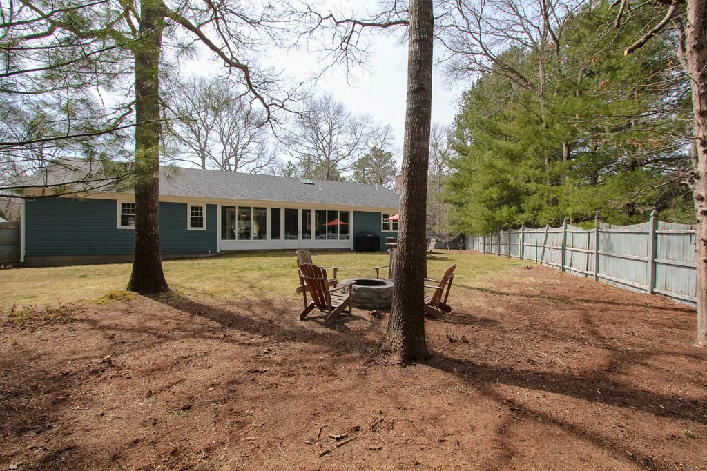 47 Foxglove Road Barnstable, MA 02632 - Photo 28 of 33 a view of a house with backyard and sitting area