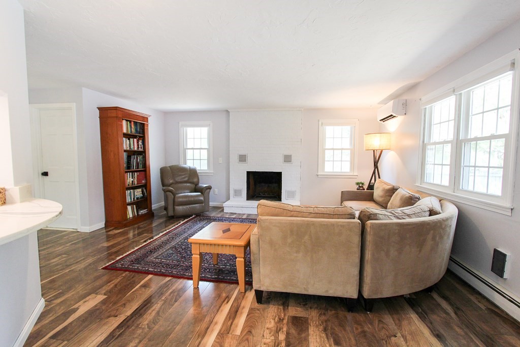 47 Foxglove Road Barnstable, MA 02632 - Photo 3 of 33 a living room with furniture and a wooden floor