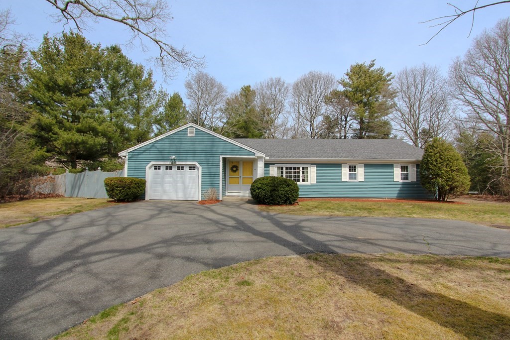 47 Foxglove Road Barnstable, MA 02632 - Photo 31 of 33 a front view of a house with a yard and trees